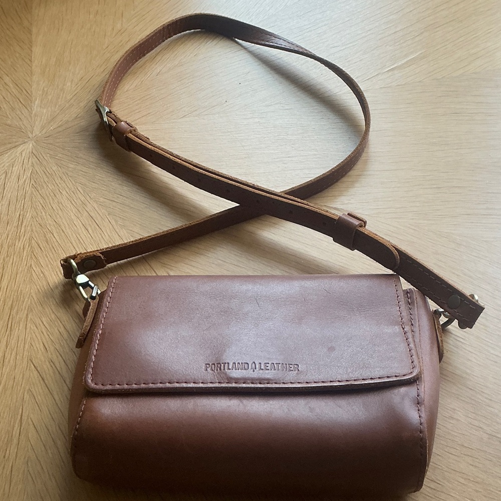 Portland Leather mini Metro Crossbody bag in their Honey color.